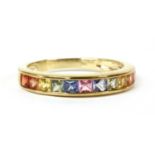 A gold rainbow sapphire half eternity ring,