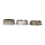 Three white gold wedding rings,