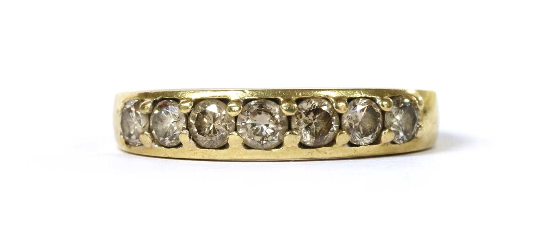 A gold seven stone diamond ring,