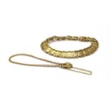 A gold panel bracelet,