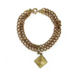 A gold two row curb link bracelet,