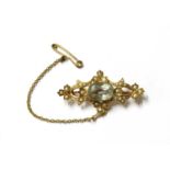 An Edwardian gold aquamarine and split pearl brooch,