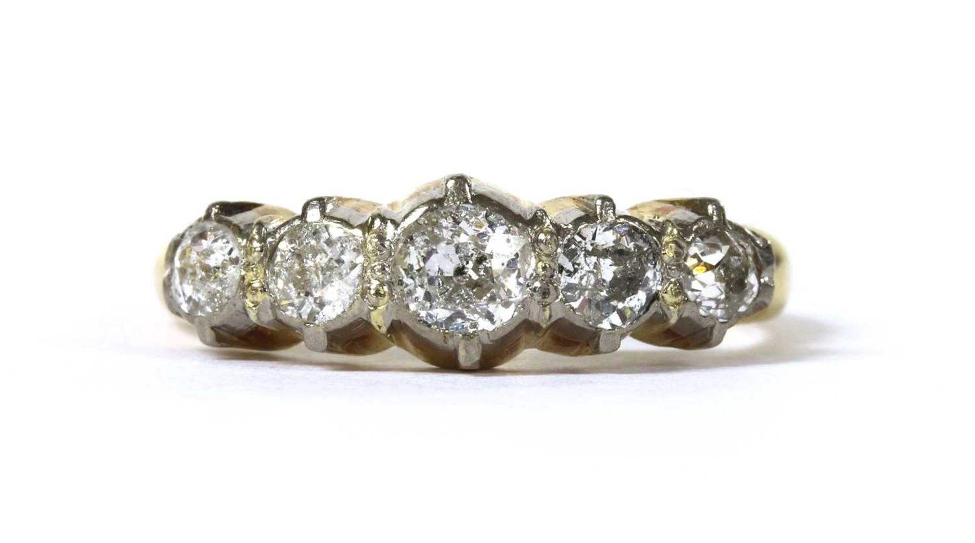 A gold five stone diamond ring,