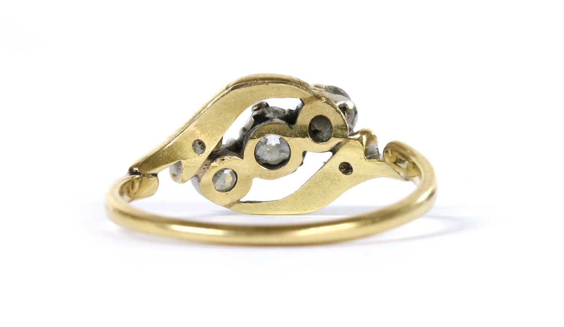 A gold three stone diamond crossover ring, - Image 3 of 3
