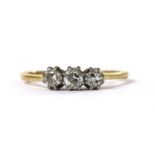 A gold three stone diamond ring,