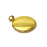 An 18ct gold circular locket,