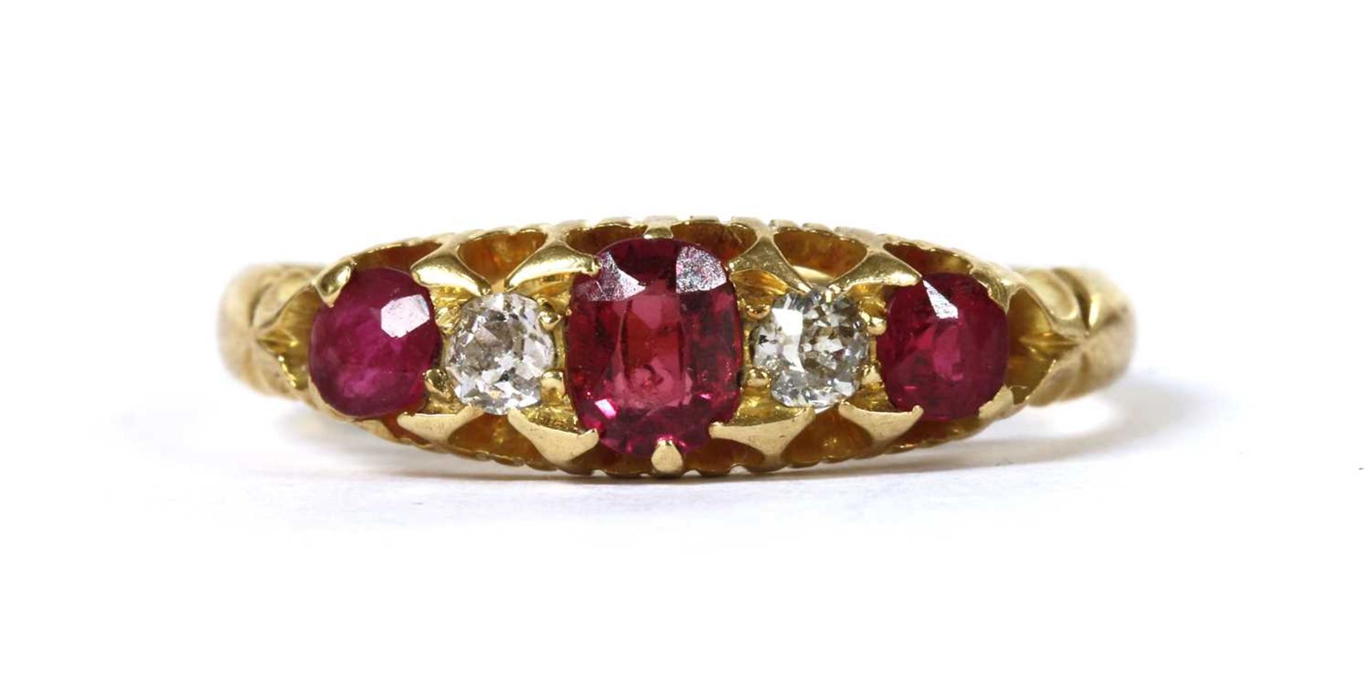 An 18ct gold ruby and diamond five stone ring,