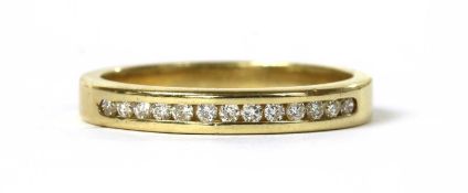 A gold diamond band ring,