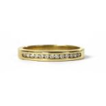 A gold diamond band ring,