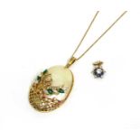 A gold mother-of-pearl and paste set pendant,