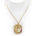 A gold mother-of-pearl and cubic zirconia set pendant,