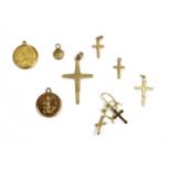 Four 9ct gold cross pendants,