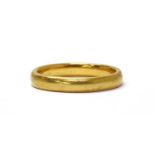 A 22ct gold court section wedding ring,