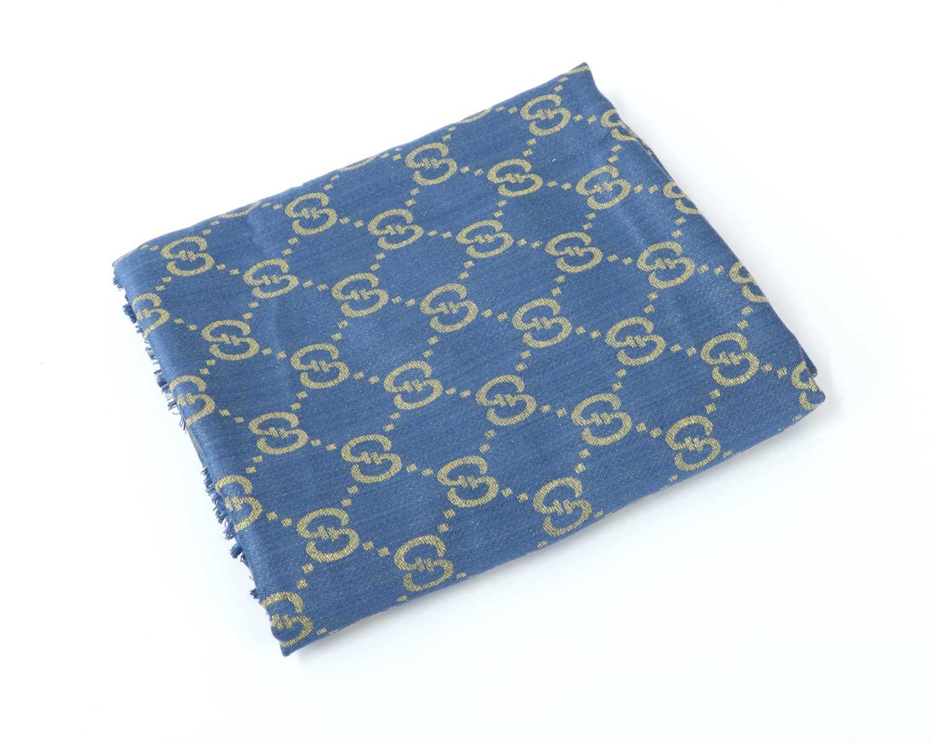 A Gucci cashmere and silk blue and gold long scarf,