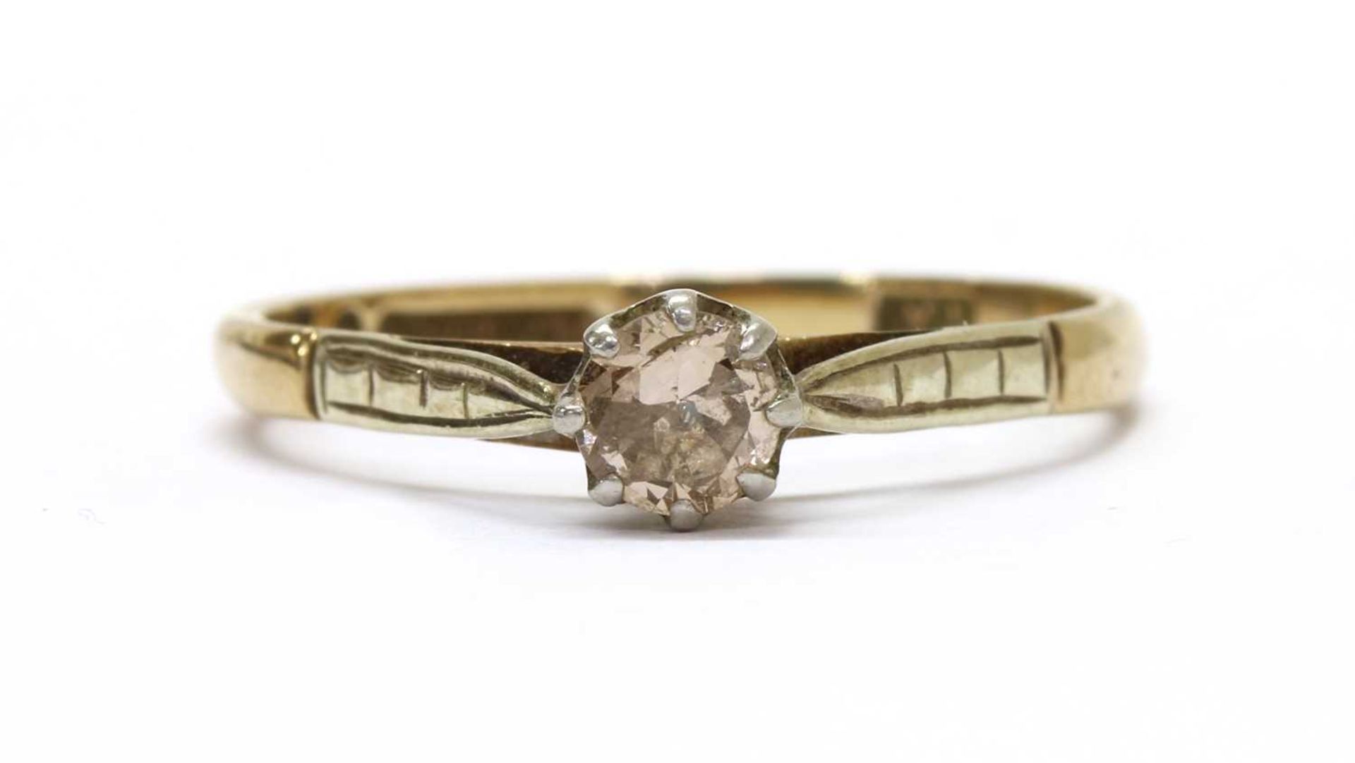 A gold single stone diamond ring,