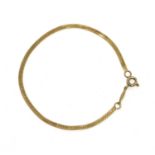 A gold herringbone link bracelet,