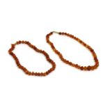 A single row uniform butterscotch amber bead string,