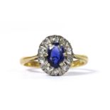 An 18ct gold sapphire and diamond cluster ring,