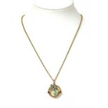 An Edwardian gold ruby, pearl and enamel floral pendant,