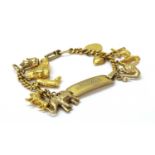 A gold filled identity bracelet with gold charms,