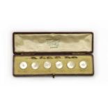 A cased set of six gold mother-of-pearl buttons,