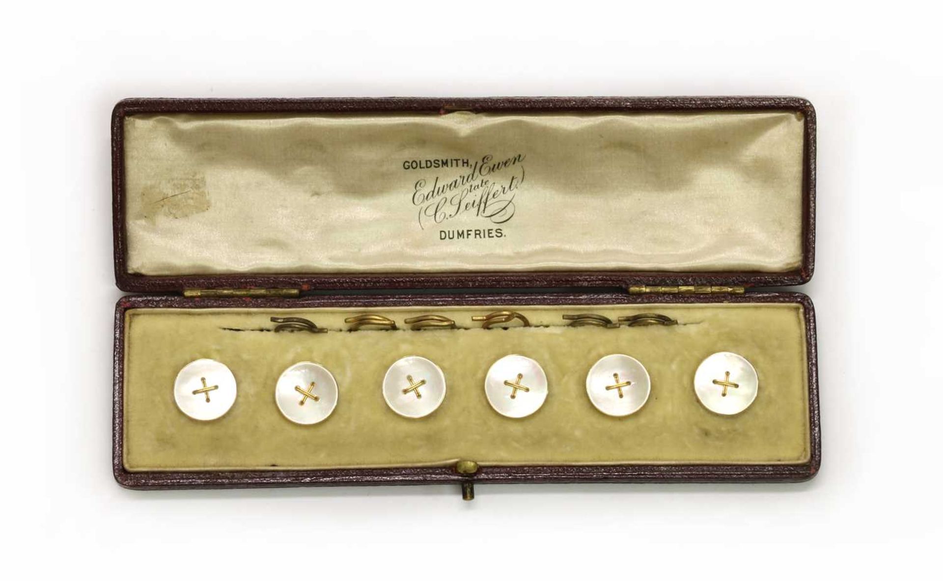 A cased set of six gold mother-of-pearl buttons,