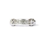 A 9ct white gold diamond half eternity ring,