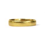 A 22ct gold flat section wedding ring,