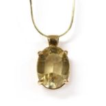 A gold citrine pendant,