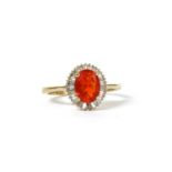 A gold fire opal and diamond cluster ring,