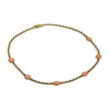 A 9ct gold coral necklace,