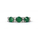 A gold eleven stone emerald and diamond ring,