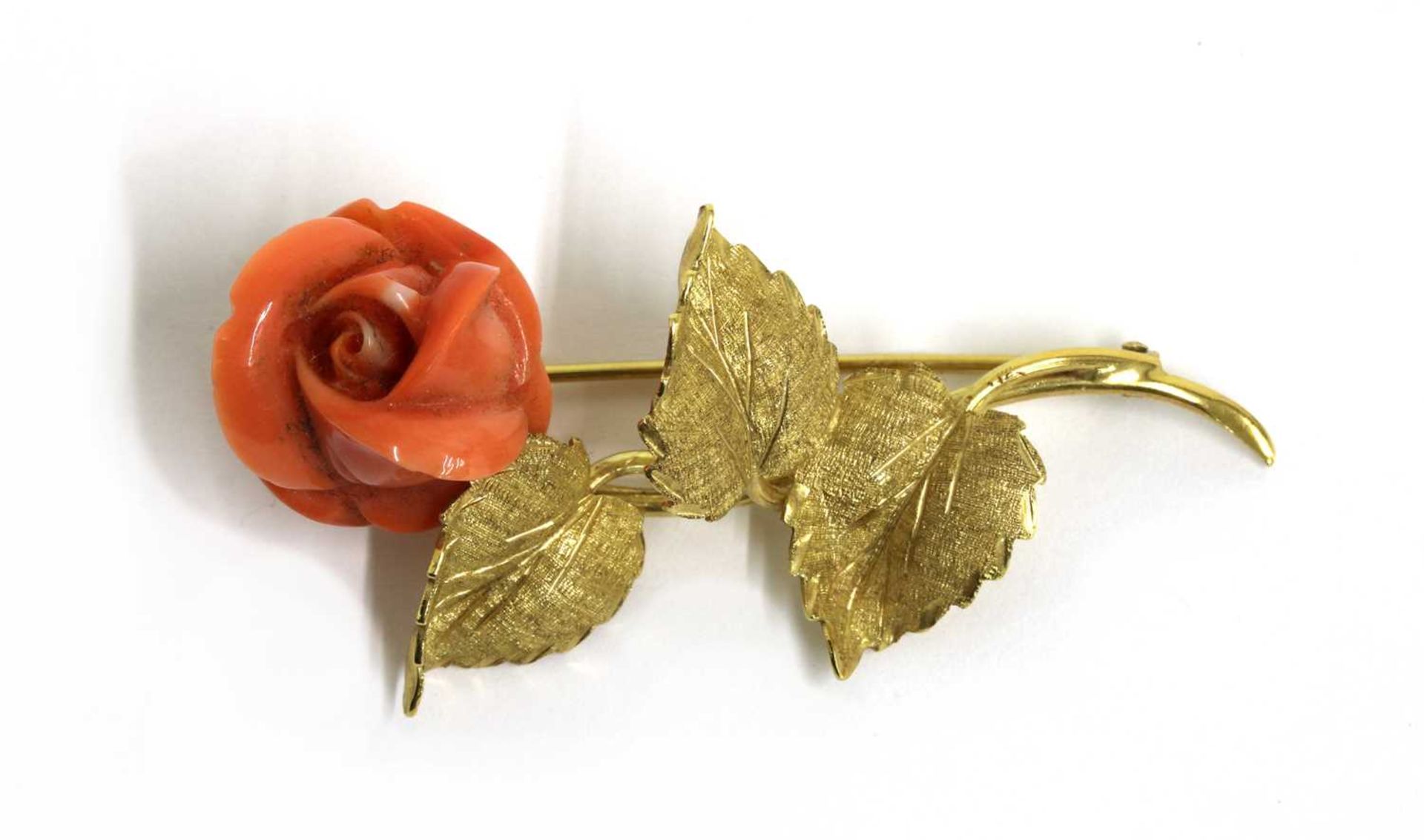 An Italian gold carved coral brooch,