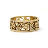 A 9ct gold pierced band ring,