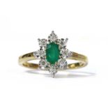 A gold emerald and diamond cluster ring,