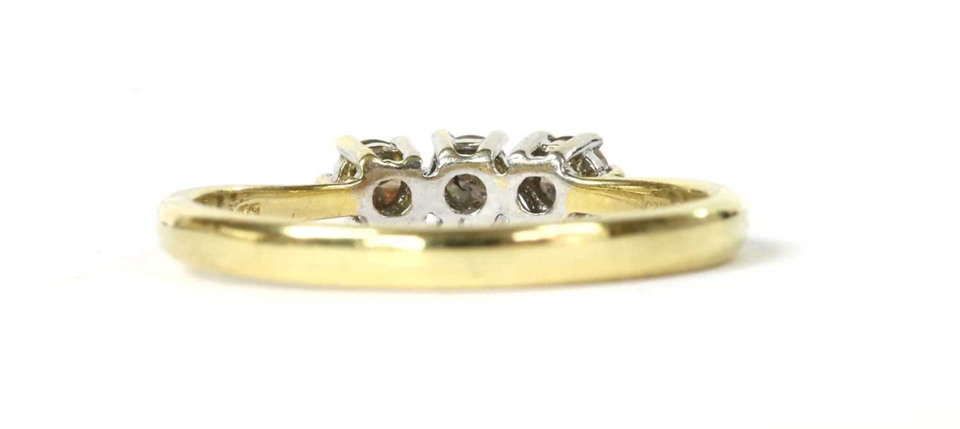 An 18ct gold three stone diamond ring, - Image 3 of 3