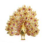 A gold ruby and split pearl peacock pendant,