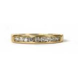 A gold diamond half eternity ring,