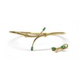 A gold emerald bangle,