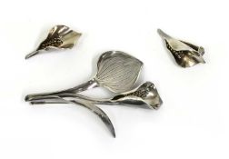 A Danish silver calla lily brooch and earrings suite, by Anton Michelsen,