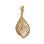 A gold cubic zirconia set shell or leaf form pendant,