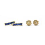 A pair of gold diamond earrings,