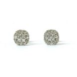 A pair of white gold diamond cluster earrings,