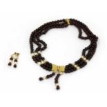 A three row garnet bead and cultured pearl necklace,