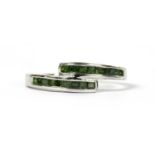 A 9ct white gold treated green diamond crossover ring,
