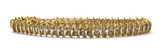 A gold diamond set bracelet,