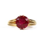 A gold single stone synthetic ruby ring,