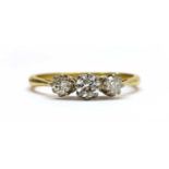 An 18ct gold three stone diamond ring,