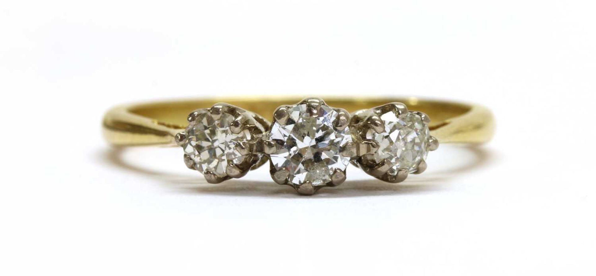 An 18ct gold three stone diamond ring,