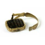 A Georgian gold enamel memorial swivel ring,